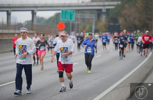 Douglas Fulle (left) and Harold Frediani run down 400 during the GA 400 Pay the Last Toll Race in Atlanta on Sunday, November 17, 2013. 