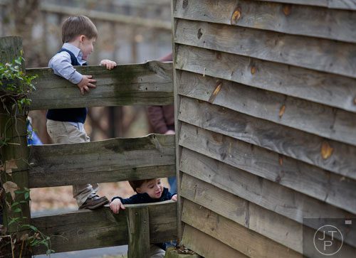 Logan Walker (left) and his brother Harrison play on a fence during A Civil War Christmas at McDaniel Farm Park in Duluth on Saturday, November 16, 2013. 