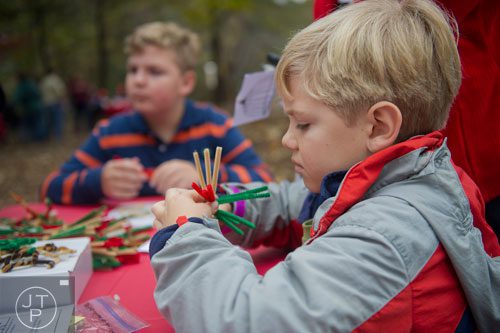 Logan Lerew (right) and his brother Chase make pipe cleaner ornaments during A Civil War Christmas at McDaniel Farm Park in Duluth on Saturday, November 16, 2013. 