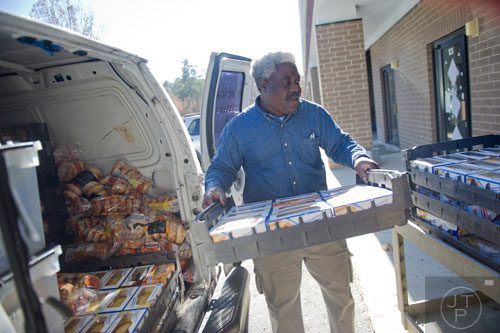 Credo Credolawson unloads a van full of bread at Daily Bread for All in Norcross on Thursday, November 14, 2013.