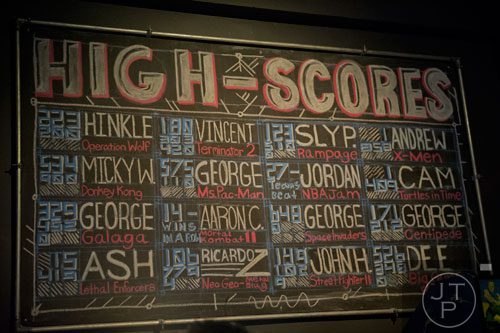 High scores are placed on a chalk board for all to see at Joystick Game Bar in the Old Fourth Ward neighborhood of Atlanta on Saturday, November 2, 2013.