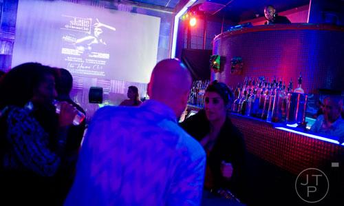 The DJ spins salsa music at the Havana Club in Buckhead on Saturday, November 2, 2013.