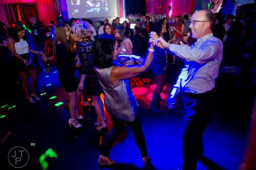Patricia Van Sickel (left) dances with Doug Kirsop at the Havana Club in the Buckhead neighborhood of Atlanta on Saturday, November 2, 2013. 