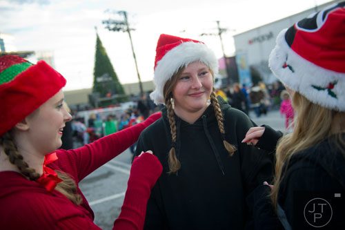 Lexy Gilbert (center) gets help fixing her hair from Emily Whitton (left) and Kayla McElreath during the 66th annual Macy's Great Tree Lighting at Lenox Square Mall in Atlanta on Thursday, November 28, 2013. 