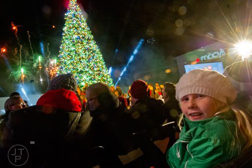 Charlotte Cleaver (right) looks around during the fireworks display at the end of the 66th annual Macy's Great Tree Lighting at Lenox Square Mall in Atlanta on Thursday, November 28, 2013. 