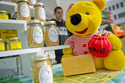 The Home Town Honey booth at the farmers market in Marietta Square has a bunch of choices when it comes to gifts for the holidays including bees wax bars and candles, bee pollen and jars of local honey. 