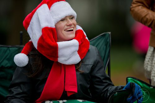 Nicole Huntington laughs as she waits for the start of the 33rd annual Children's Christmas Parade in Atlanta on Saturday, December 7, 2013.