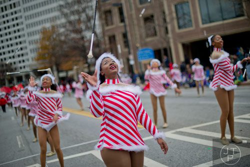 Clinetra Rush (left) tosses her baton into the air during the 33rd annual Children's Christmas Parade in Atlanta on Saturday, December 7, 2013. 