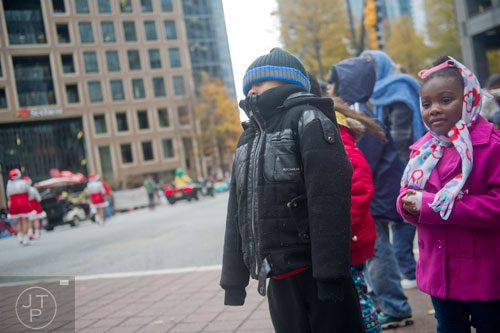 Jakobi Everett (left) and his sister Jamiya watch the 33rd annual Children's Christmas Parade in Atlanta on Saturday, December 7, 2013. 