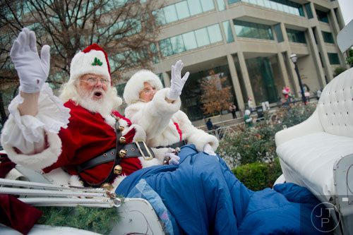Santa and Mrs. Claus wave to the crowd during the 33rd annual Children's Christmas Parade in Atlanta on Saturday, December 7, 2013. 