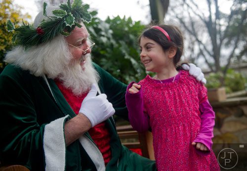 Alexandra Adams visits with Santa Claus at the Atlanta Botanical Garden on Saturday, December 7, 2013.