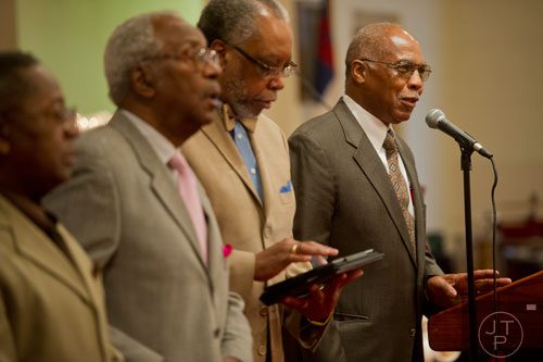 The deacons at Mt. Welcome Missionary Baptist Church in Decatur start off the worship services on Sunday, December 8, 2013.