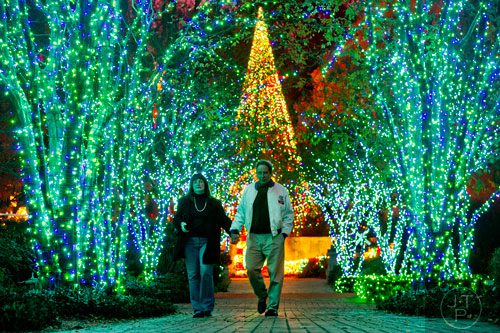 Sharon Frapwell (left) holds hands with Dave Hasulak during Garden Lights Holiday Nights at the Atlanta Botanical Garden in the Midtown neighborhood of Atlanta on Thursday, November 21, 2013.