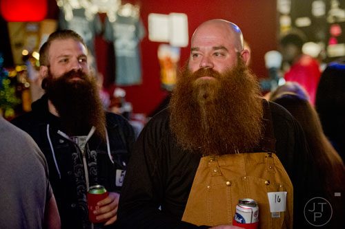Jay Taylor (right) and Troy Bedingfield wait to compete in Battle of the Beards at Smith's Olde Bar in Atlanta on Saturday, December 14, 2013. 