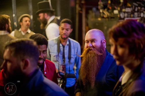 Nate Thiel (center) waits in line to register for Battle of the Beards at Smith's Olde Bar in Atlanta on Saturday, December 14, 2013. 