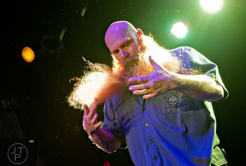 Shane Sheriff fluffs out his beard as he competes during Battle of the Beards at Smith's Olde Bar in Atlanta on Saturday, December 14, 2013. 
