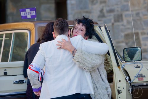 Karen Portaleo (right), Ria Pell's partner, hugs friends and family before the start of the funeral service for Pell at Westview Cemetery in Atlanta on Saturday, November 30, 2013. 