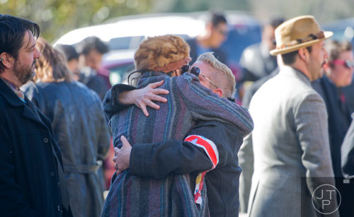 Lady Jane Meredith (right) hugs friends and family before the start of the funeral service for Ria Pell at Westview Cemetery in Atlanta on Saturday, November 30, 2013. 