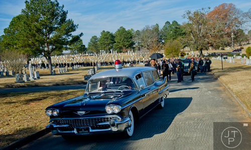The hearse carrying Ria Pell is followed by well over 1,000 people as it leads to the graveside service at Westview Cemetery in Atlanta on Saturday, November 30, 2013.