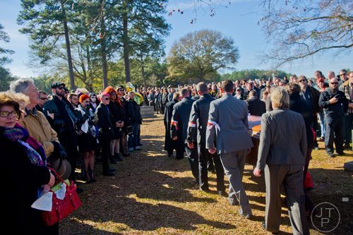Pall bearers carry the casket of Ria Pell to the graveside service at Westview Cemetery in Atlanta on Saturday, November 30, 2013. 