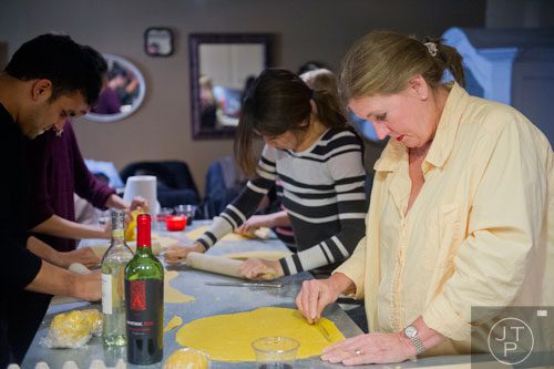 Anne Hodges (right) cuts her dough into squares as she prepares her handmade ravioli during the Pastabilities class at The Cooking School at Irwin Street in Atlanta on Saturday, January 18, 2014. 