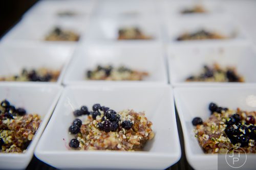 Plates of millet and quinoa porridge topped with blueberries and hemp seed are ready to be served during the Exploring a Plant-Based Diet class at the Cook's Warehouse in Marietta on Tuesday, January 21, 2014.