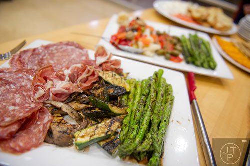 Grilled vegetables, prosciutto and salami sit on a plate during a cooking class at the Salud Cooking School at Harry's Farmers Market in Roswell on Thursday, January 23, 2014.