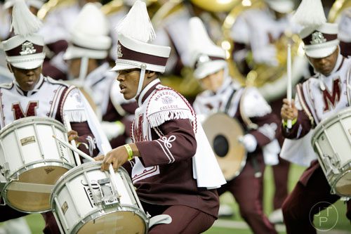 Morehouse College's Jordan Rogers (center) marches while playing the snare drum during the 2014 Honda Battle of the Bands at the Georgia Dome in Atlanta on Saturday, January 25, 2014. 