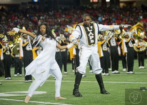 University of Arkansas at Pine Bluff's Sydnei Howard (left) dances with drum major Antwuan Walters during the 2014 Honda Battle of the Bands at the Georgia Dome in Atlanta on Saturday, January 25, 2014. 