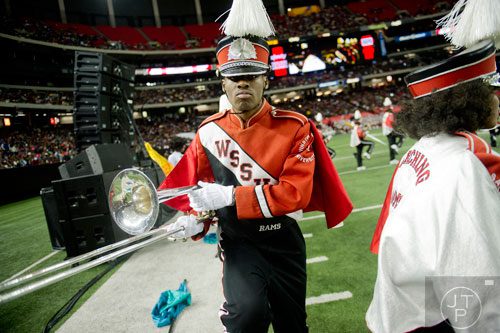 Winston Salem State University's Kevin Malone (center) marches onto the field during the 2014 Honda Battle of the Bands at the Georgia Dome in Atlanta on Saturday, January 25, 2014.