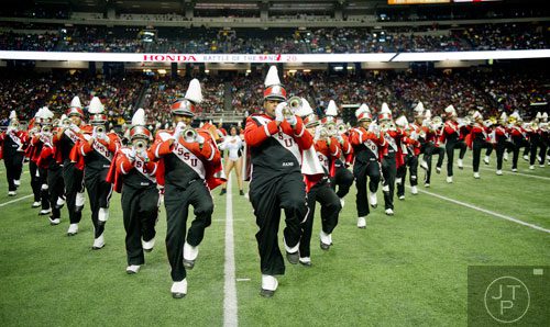 Winston Salem State University's Christian Orr (center left) and Darrion Keck (center right) march as they play their trumpets during the 2014 Honda Battle of the Bands at the Georgia Dome in Atlanta on Saturday, January 25, 2014. 