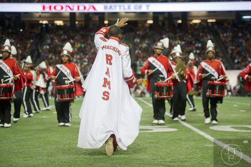 Winston Salem State University drum major Braxton Allen (center) marches on the field during the 2014 Honda Battle of the Bands at the Georgia Dome in Atlanta on Saturday, January 25, 2014. 