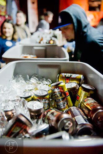 Beers sit in buckets of ice during the Atlanta Winter Beerfest at the Masquerade in Atlanta on Sunday, January 26, 2014.