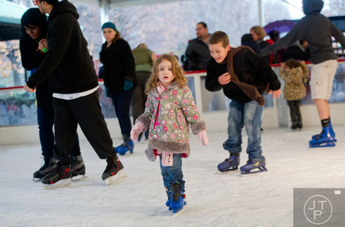 Maria Chappel (center) ice skates at Centennial Olympic Park in downtown Atlanta on Sunday, December 8, 2013. 