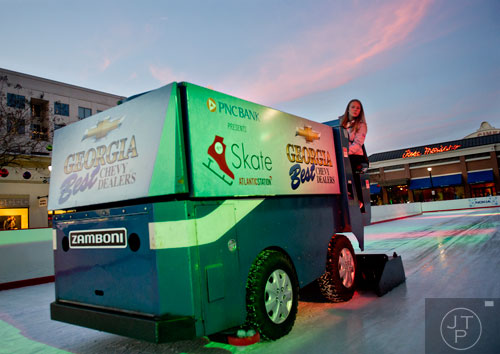 Kalee Stoever uses a zamboni to smooth the ice at Atlantic Station on Thursday, December 19, 2013.