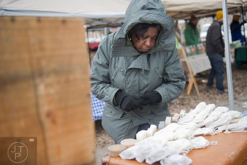 Cleo Daniels looks at handmade soap for sale at the Decatur Farmers Market on Saturday, January 4, 2014.