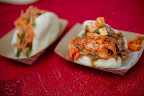 Stuffed steamed buns topped with kimchi sit on the table at the Simply Seoul booth at the Decatur Farmers Market on Saturday, January 4, 2014. 