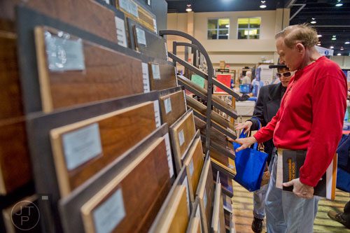 Jim Floyd (right) and his wife Paula look at flooring options on display at the North Atlanta Home Show at the Gwinnett Center in Duluth on Sunday, February 23, 2014. 