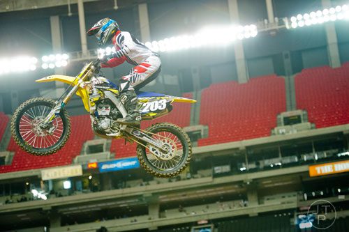 Chad Ward (203) catches some air as he competes in a qualifying round of the Monster Energy AMA Supercross FMI World Championship at the Georgia Dome in Atlanta on Saturday, February 22, 2014.  
