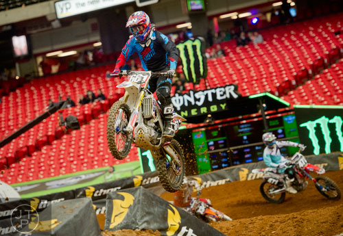 Michael Lang (661) catches some air as he competes in a qualifying round of the Monster Energy AMA Supercross FMI World Championship at the Georgia Dome in Atlanta on Saturday, February 22, 2014.