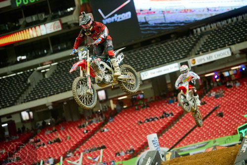 Vince Friese (42) catches some air as he competes in a qualifying round of the Monster Energy AMA Supercross FMI World Championship at the Georgia Dome in Atlanta on Saturday, February 22, 2014. 