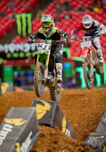 Martin Davalos (31) catches some air as he competes in a qualifying round of the Monster Energy AMA Supercross FMI World Championship at the Georgia Dome in Atlanta on Saturday, February 22, 2014. 