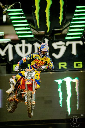 Ryan Dungey (5) catches some air as he competes in a qualifying round of the Monster Energy AMA Supercross FMI World Championship at the Georgia Dome in Atlanta on Saturday, February 22, 2014. 