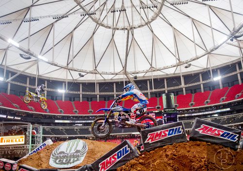 Justin Brayton (10) catches some air as he competes in a qualifying round of the Monster Energy AMA Supercross FMI World Championship at the Georgia Dome in Atlanta on Saturday, February 22, 2014.  
