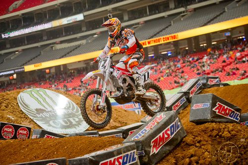 Jimmy Albertson (77) catches some air as he competes in a qualifying round of the Monster Energy AMA Supercross FMI World Championship at the Georgia Dome in Atlanta on Saturday, February 22, 2014. 