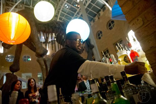 Will Johnson bartends during Martinis & IMAX at the Fernbank Museum of Natural History in Atlanta on Friday, January 31, 2014. J