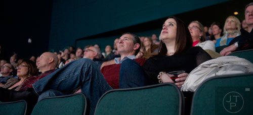 Sonia Levine (right) and Aaron Ellentuck watch a movie during Martinis & IMAX at the Fernbank Museum of Natural History in Atlanta on Friday, January 31, 2014.