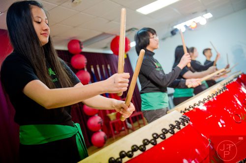 Julia Moldenhawer (left) plays the drum as she performs with other students from the Taiwanese School of Atlanta during the Atlanta Chinese Lunar New Year Festival in Chamblee on Saturday, February 1, 2014. 