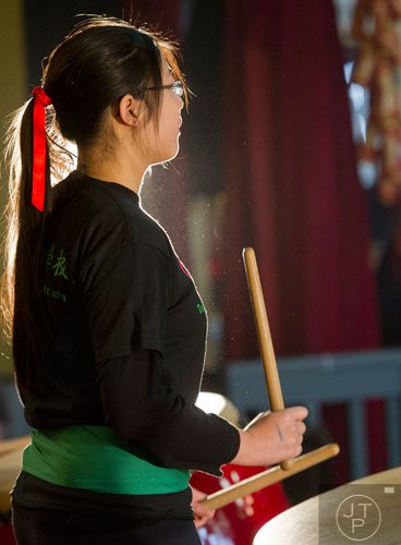 Shelley Tau plays the drum as she performs with other students from the Taiwanese School of Atlanta during the Atlanta Chinese Lunar New Year Festival in Chamblee on Saturday, February 1, 2014.