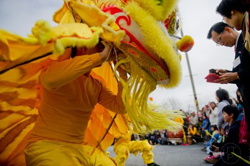 Harold Lin (left) entertains the crowd as he performs during the Atlanta Chinese Lunar New Year Festival in Chamblee on Saturday, February 1, 2014. 